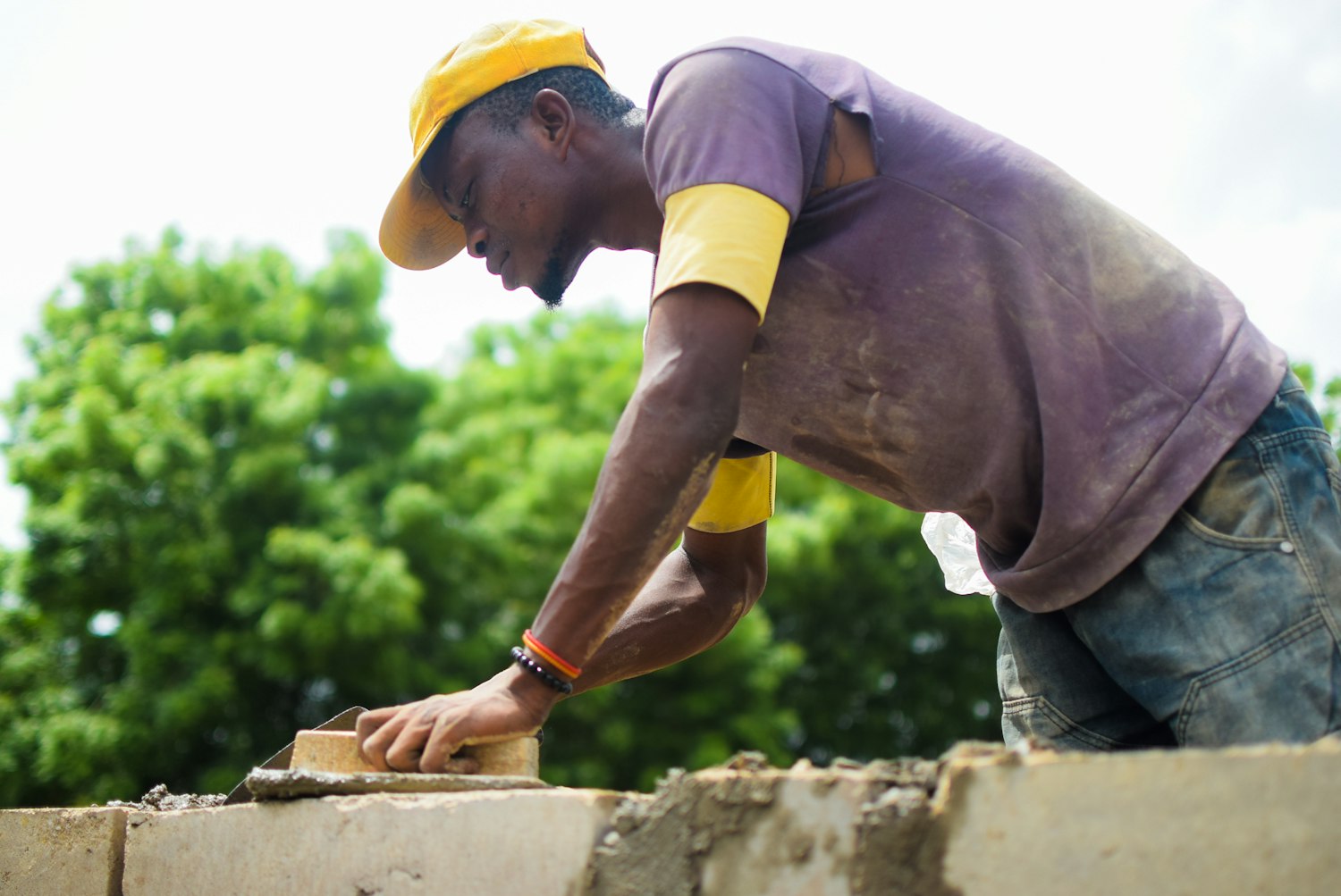 Bricklayer laying a wall
