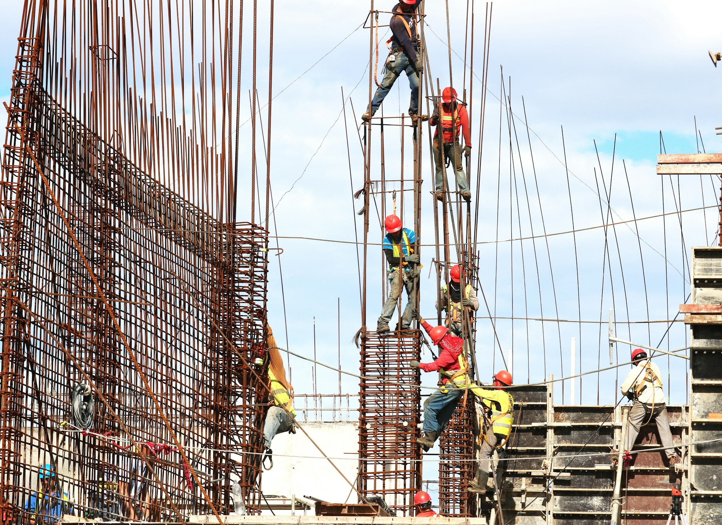 Builders working on steel reinforcement on a construction site