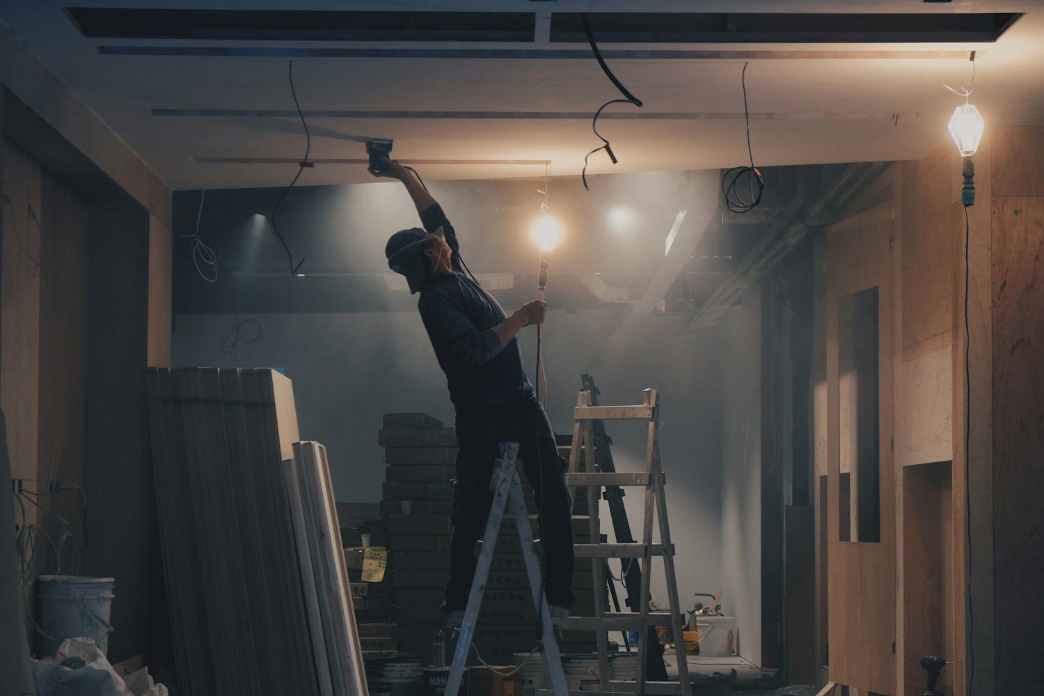 Worker finishing an interior ceiling